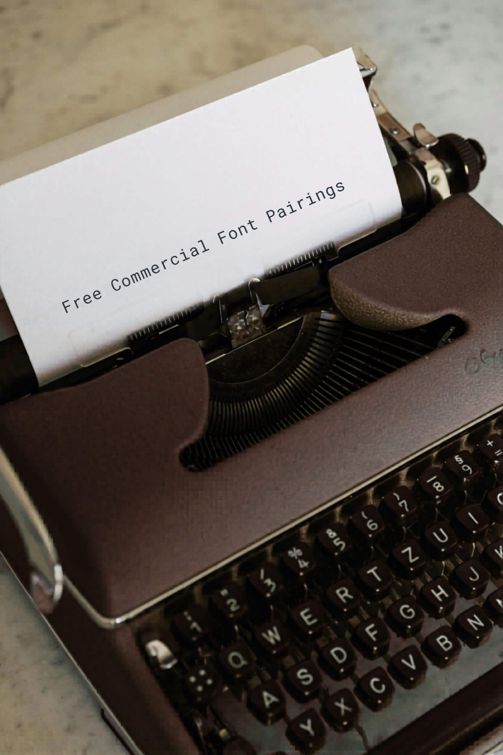 An image of a brown typewriter printing a piece of paper that says Free Commercial Font Pairings